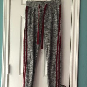 Grey track pants with red stripes